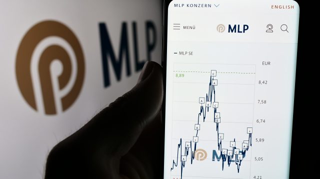 Stuttgart, Germany - 07-15-2024: Person holding mobile phone with website of German financial services company MLP SE in front of business logo. Focus on center of phone display.