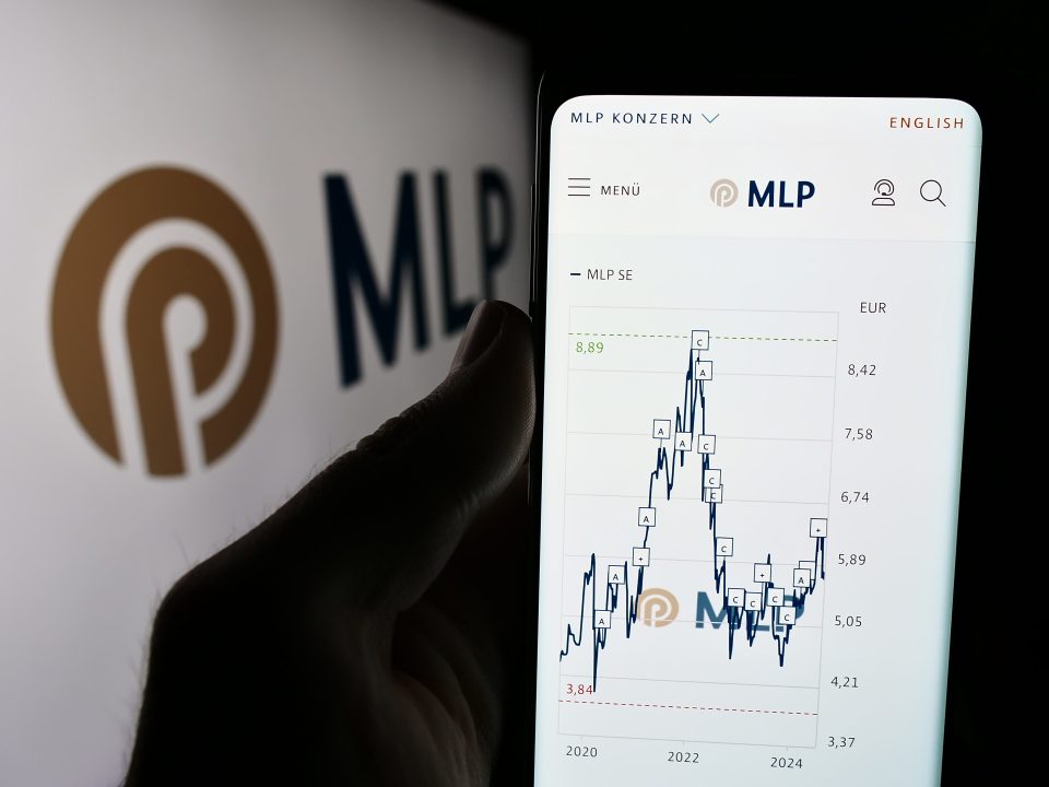 Stuttgart, Germany - 07-15-2024: Person holding mobile phone with website of German financial services company MLP SE in front of business logo. Focus on center of phone display.