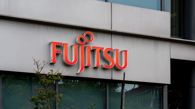 Montreal, QC, Canada - September 6, 2021: Close up of Fujitsu sign on their office building in Montreal, QC, Canada. Fujitsu is a Japanese information and communication technology company.