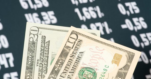 Dollar-Scheine und Kurse im Hintergrund