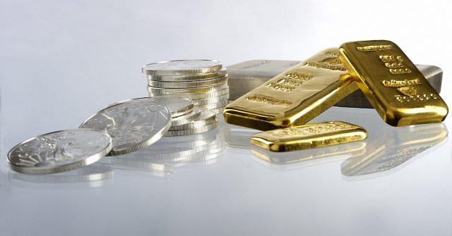 Silbermünzen und Goldbarren