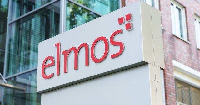 Das Elmos Logo vor einem Firmengebäude